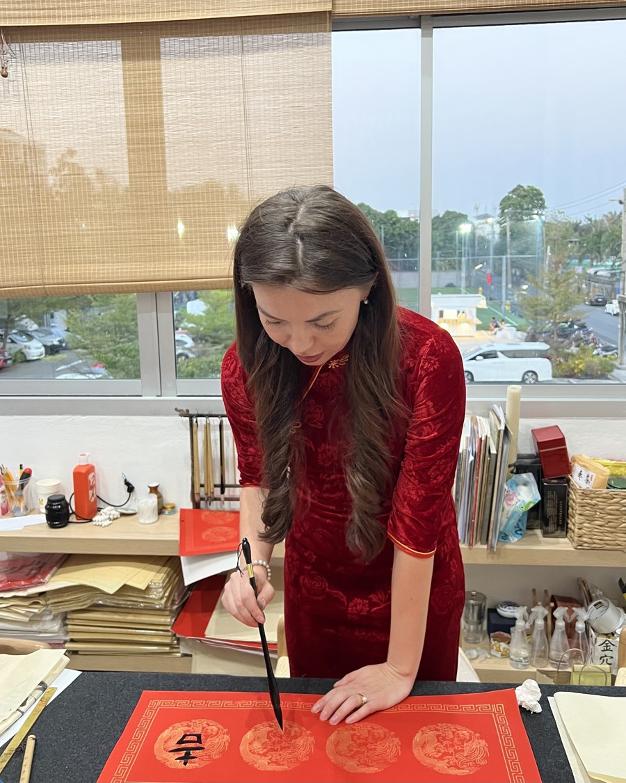 Alisa practising Chinese calligraphy