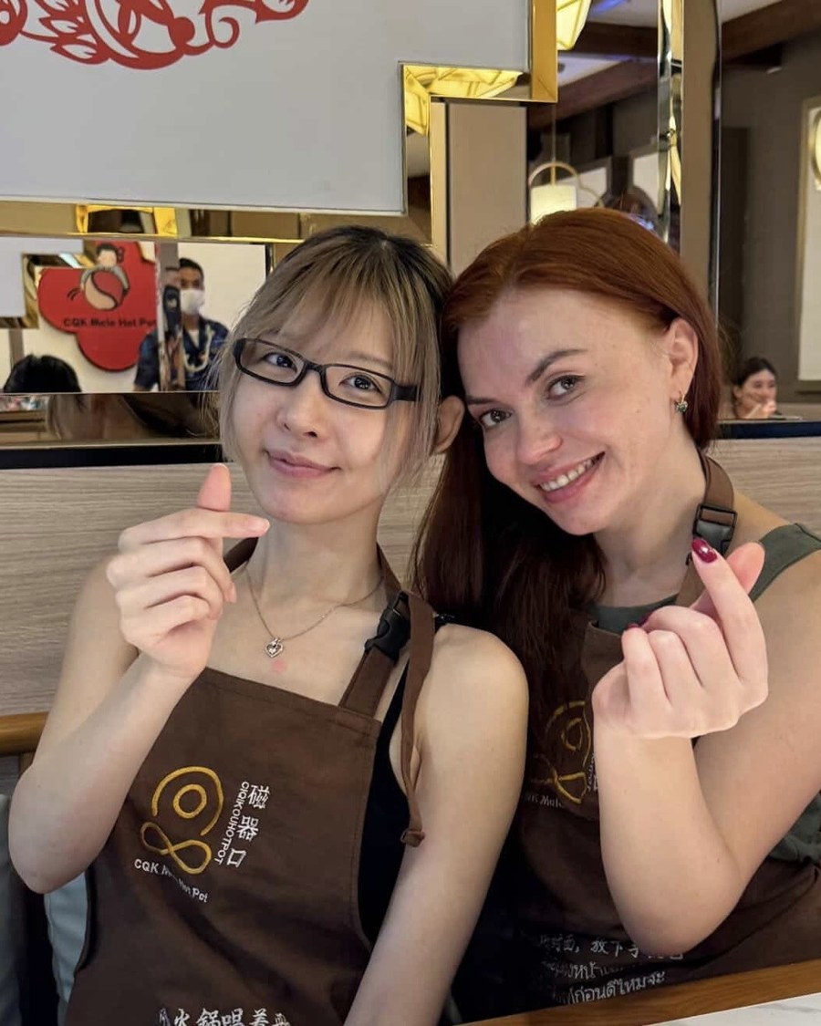 Alisa cooking with a friend in China