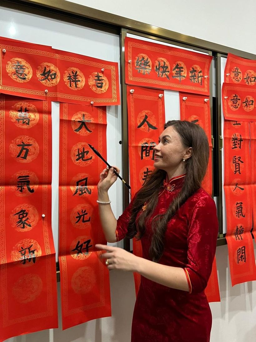 Alisa practising Chinese calligraphy